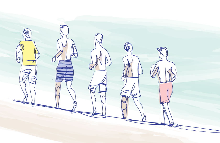 boys running on the beach